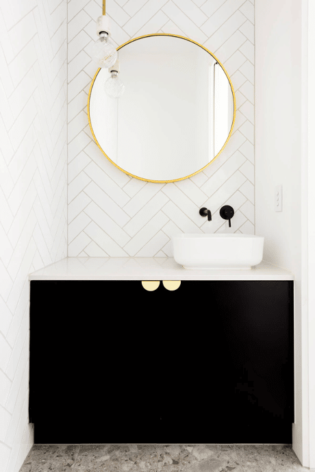 black cabinet bathroom with white tiles
