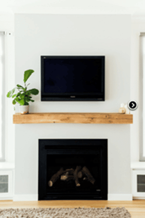 fireplace under a TV in custom family room